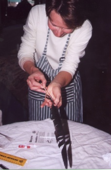 Inserting a skewer into the donor feather